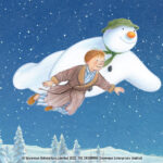 Illustration from The Snowman featuring the boy and his snowman flying through the night sky.