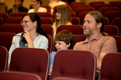 A family of three enjoying the concert season with Signature Symphony at TCC.